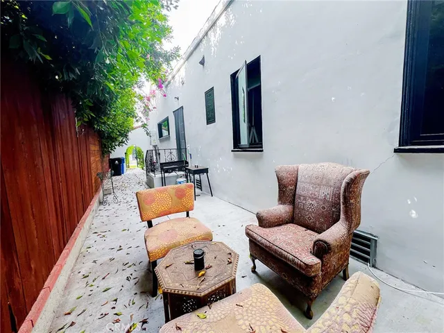 an entryway with table and a potted plant