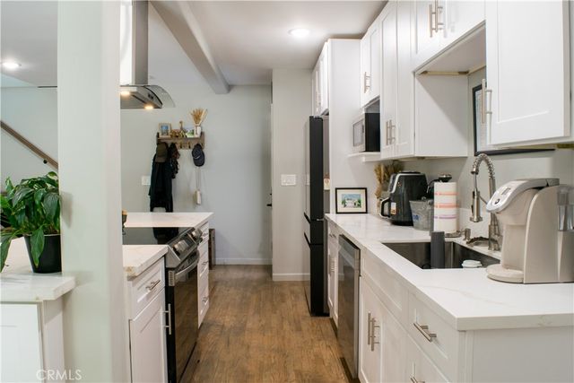 a bedroom with a bed and a desk