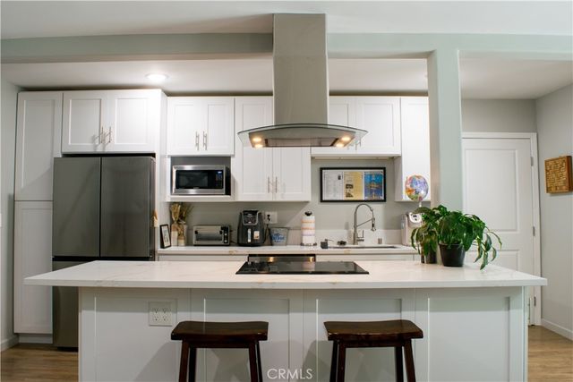 a bedroom with a bed and a dresser in it