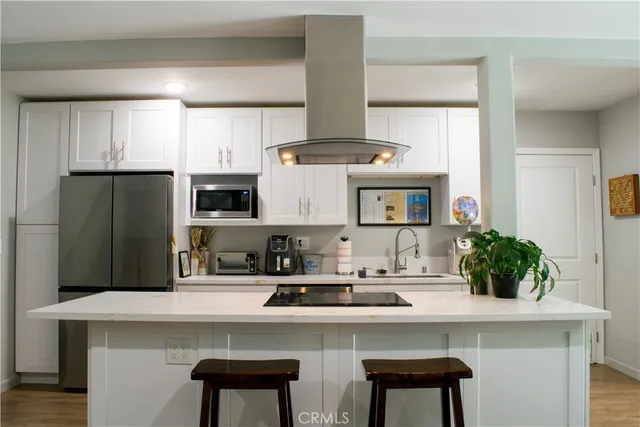 a bedroom with a bed and a dresser in it