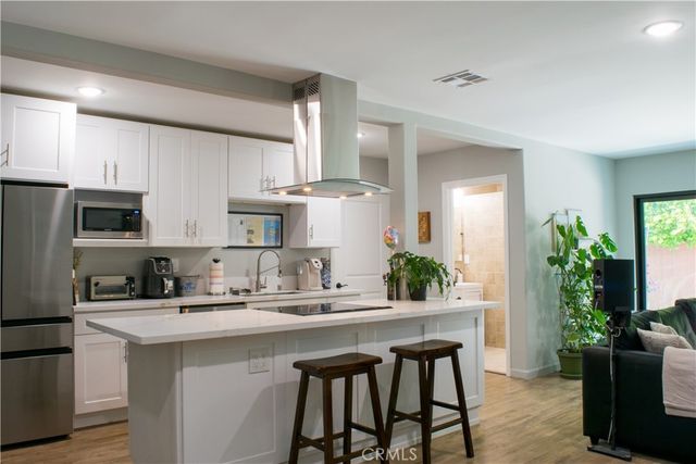 a bathroom with a sink mirror toilet and shower