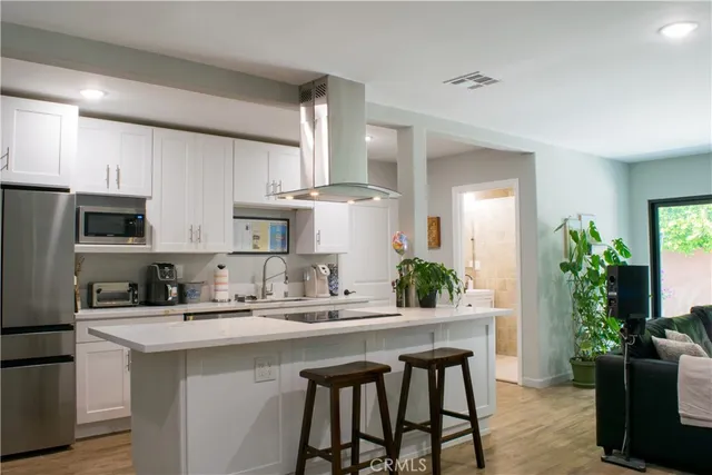 a bathroom with a sink mirror toilet and shower