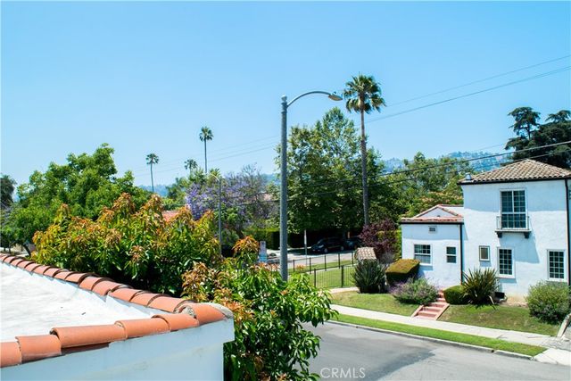 a view of swimming pool with a table and chairs