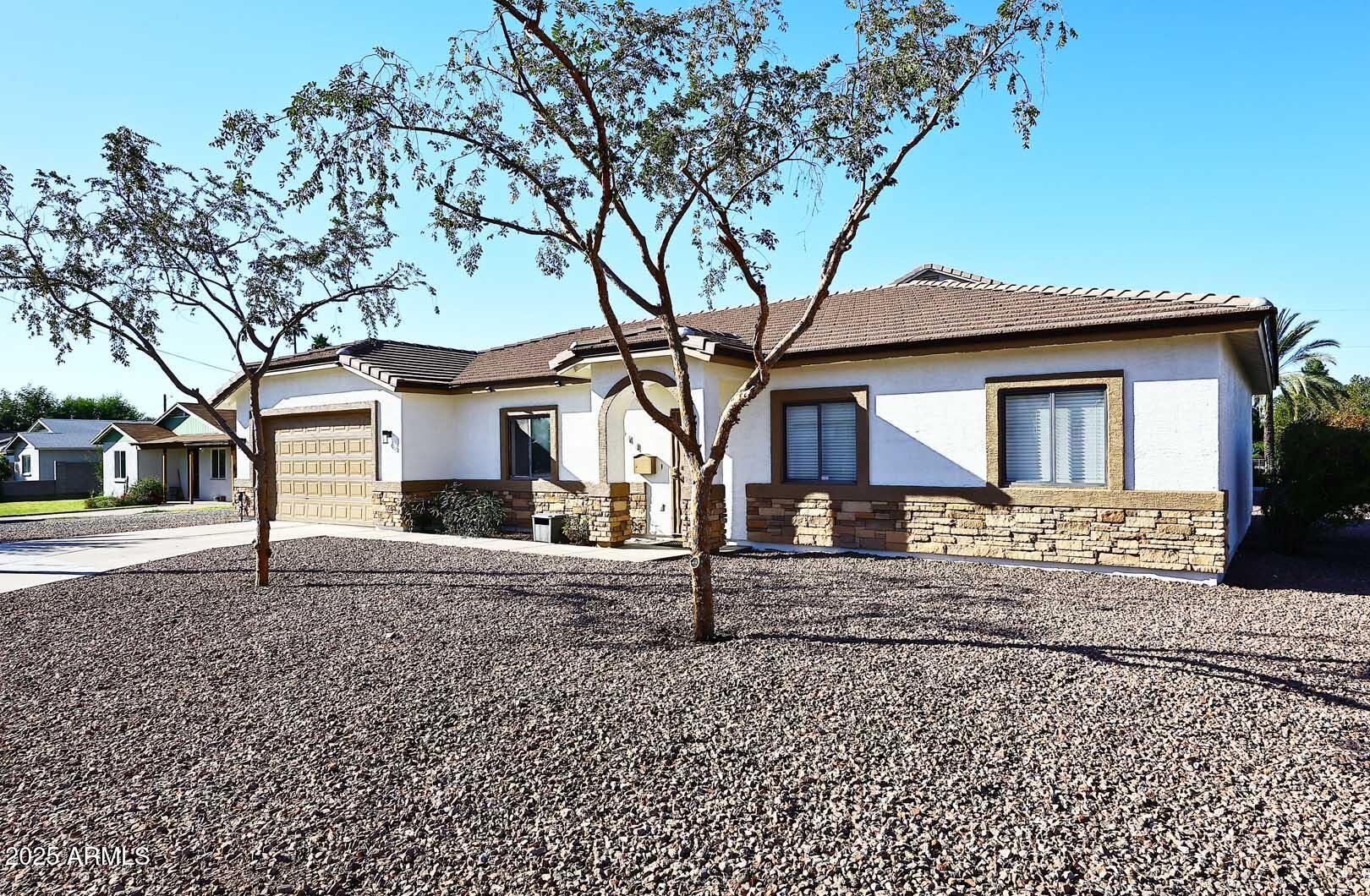 3644 North 15th Street Phoenix, AZ 85014 - Photo 1 of 26 a front view of a house with a tree