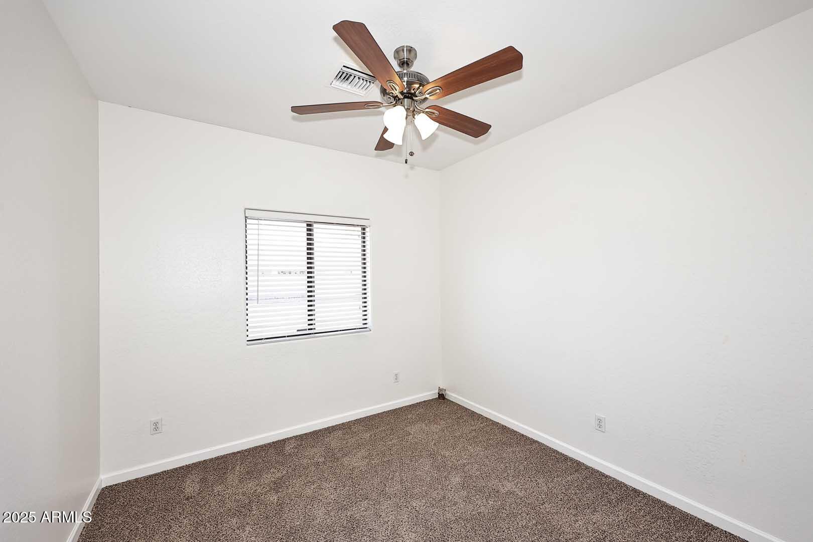 3644 North 15th Street Phoenix, AZ 85014 - Photo 15 of 26 an empty room with a window