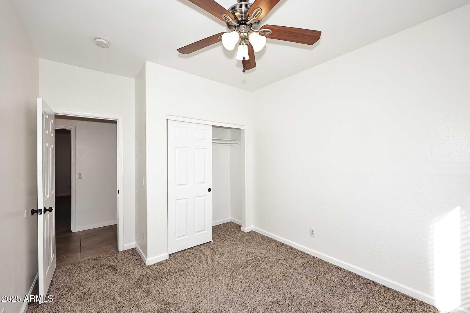 3644 North 15th Street Phoenix, AZ 85014 - Photo 19 of 26 a view of a livingroom with a chandelier fan