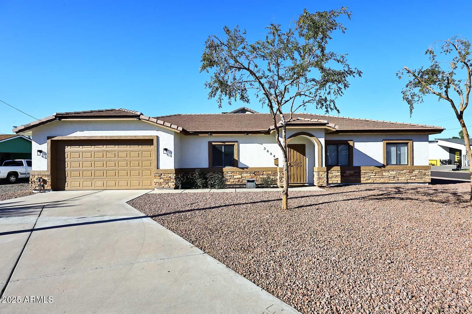 3644 North 15th Street Phoenix, AZ 85014 - Photo 2 of 26 front view of a house with a porch