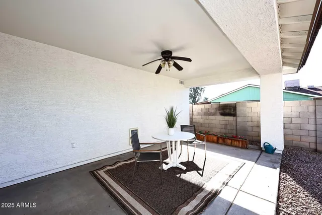 a work room with a table and chairs