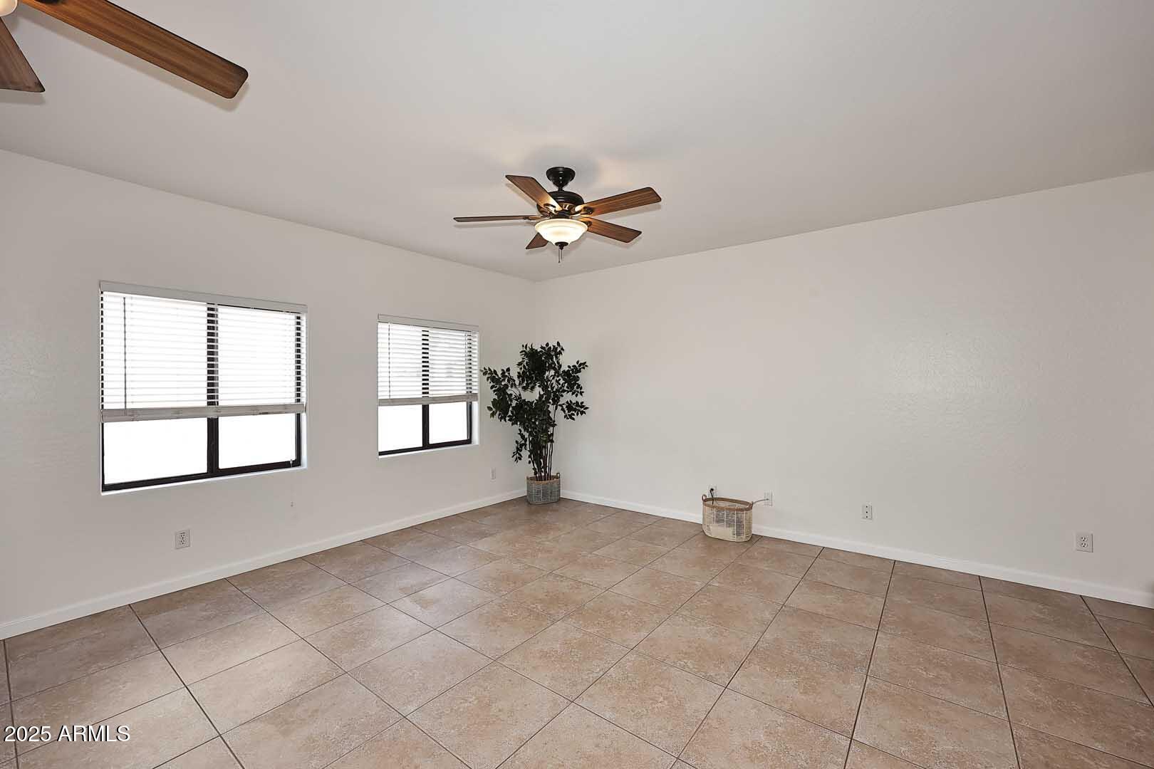 3644 North 15th Street Phoenix, AZ 85014 - Photo 7 of 26 a view of an empty room with a window