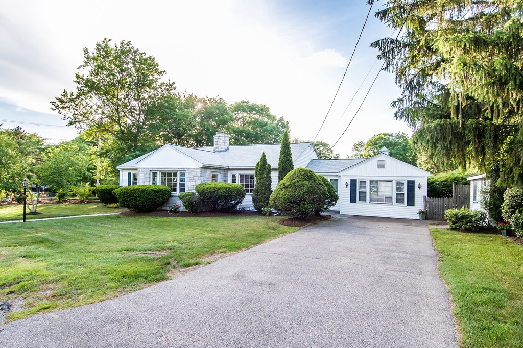 a front view of a house with garden