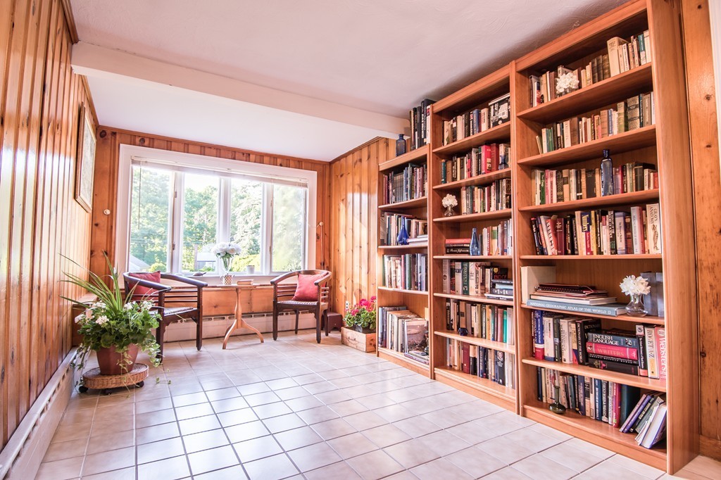 79 Park Street Dedham, MA 02026 - Photo 13 of 29 a living room with furniture and a book shelf