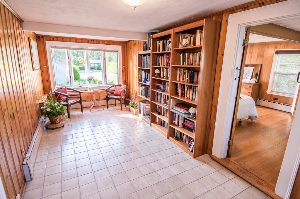 79 Park Street Dedham, MA 02026 - Photo 14 of 29 a room with furniture and a book shelf
