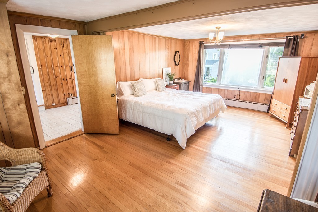 79 Park Street Dedham, MA 02026 - Photo 18 of 29 a bedroom with a bed and a large window