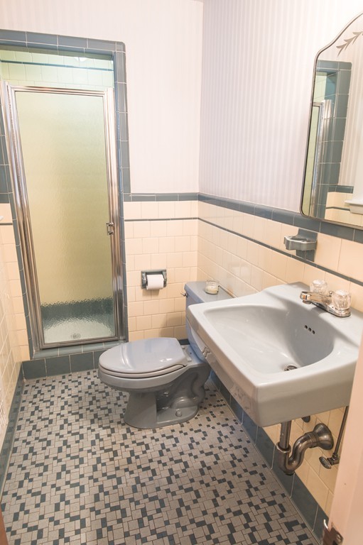 79 Park Street Dedham, MA 02026 - Photo 20 of 29 a bathroom with a sink a toilet and a mirror
