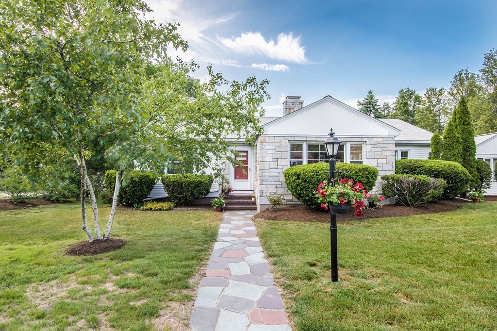 79 Park Street Dedham, MA 02026 - Photo 2 of 29 a front view of a house with a garden