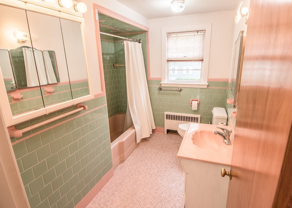 79 Park Street Dedham, MA 02026 - Photo 24 of 29 a bathroom with a sink a mirror and a shower