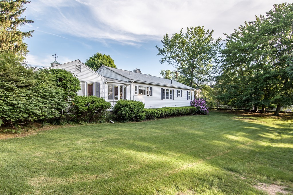 79 Park Street Dedham, MA 02026 - Photo 27 of 29 a front view of a house with a garden