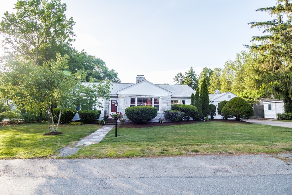 79 Park Street Dedham, MA 02026 - Photo 28 of 29 a front view of a house with a yard and garage