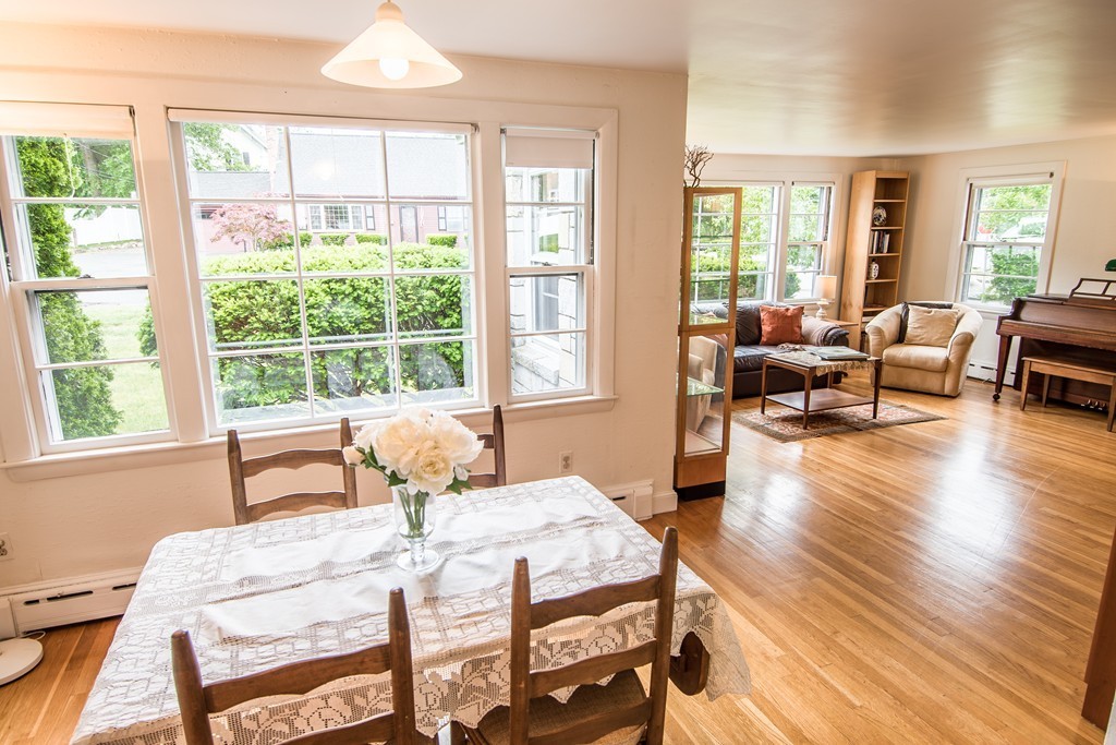 79 Park Street Dedham, MA 02026 - Photo 6 of 29 a bedroom with a bed and wooden floor