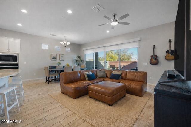 2527 South Quaintance Street Gilbert, AZ 85295 - Photo 9 of 36 a living room with furniture and a large window