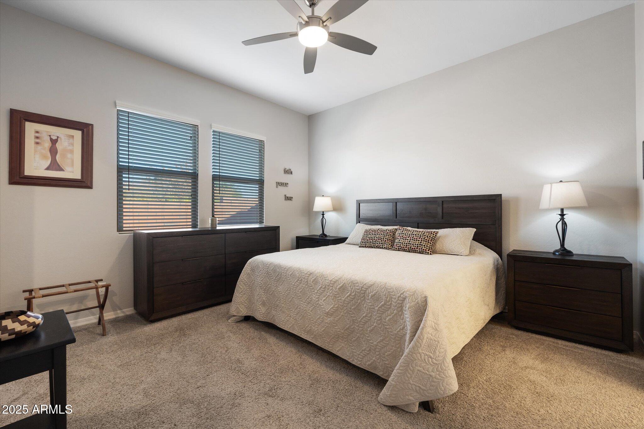 2527 South Quaintance Street Gilbert, AZ 85295 - Photo 10 of 36 a bedroom with a bed and a closet