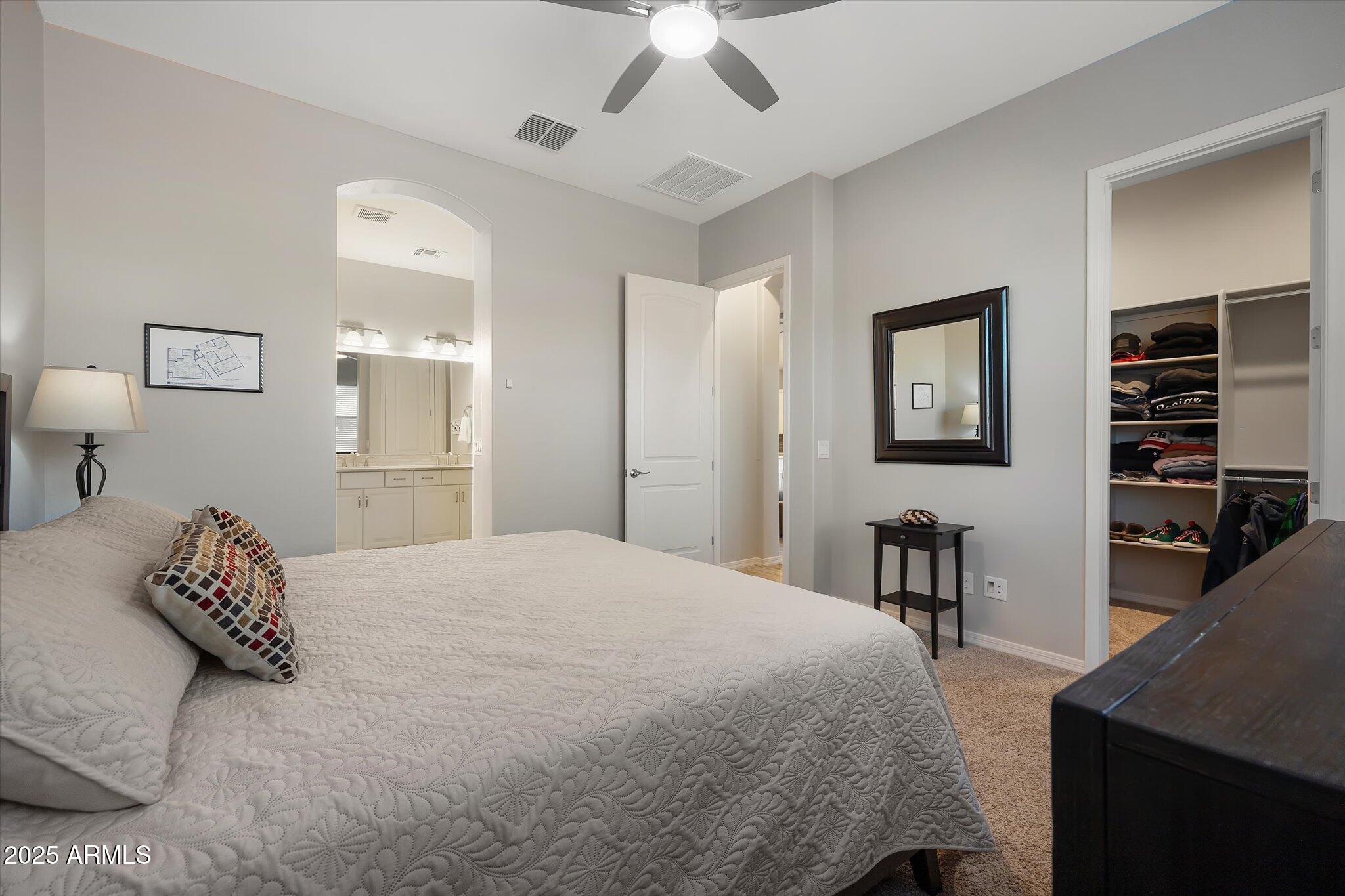 2527 South Quaintance Street Gilbert, AZ 85295 - Photo 11 of 36 a bed room with a bed and a television