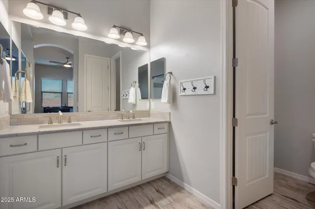 a bed room with a bed and a television