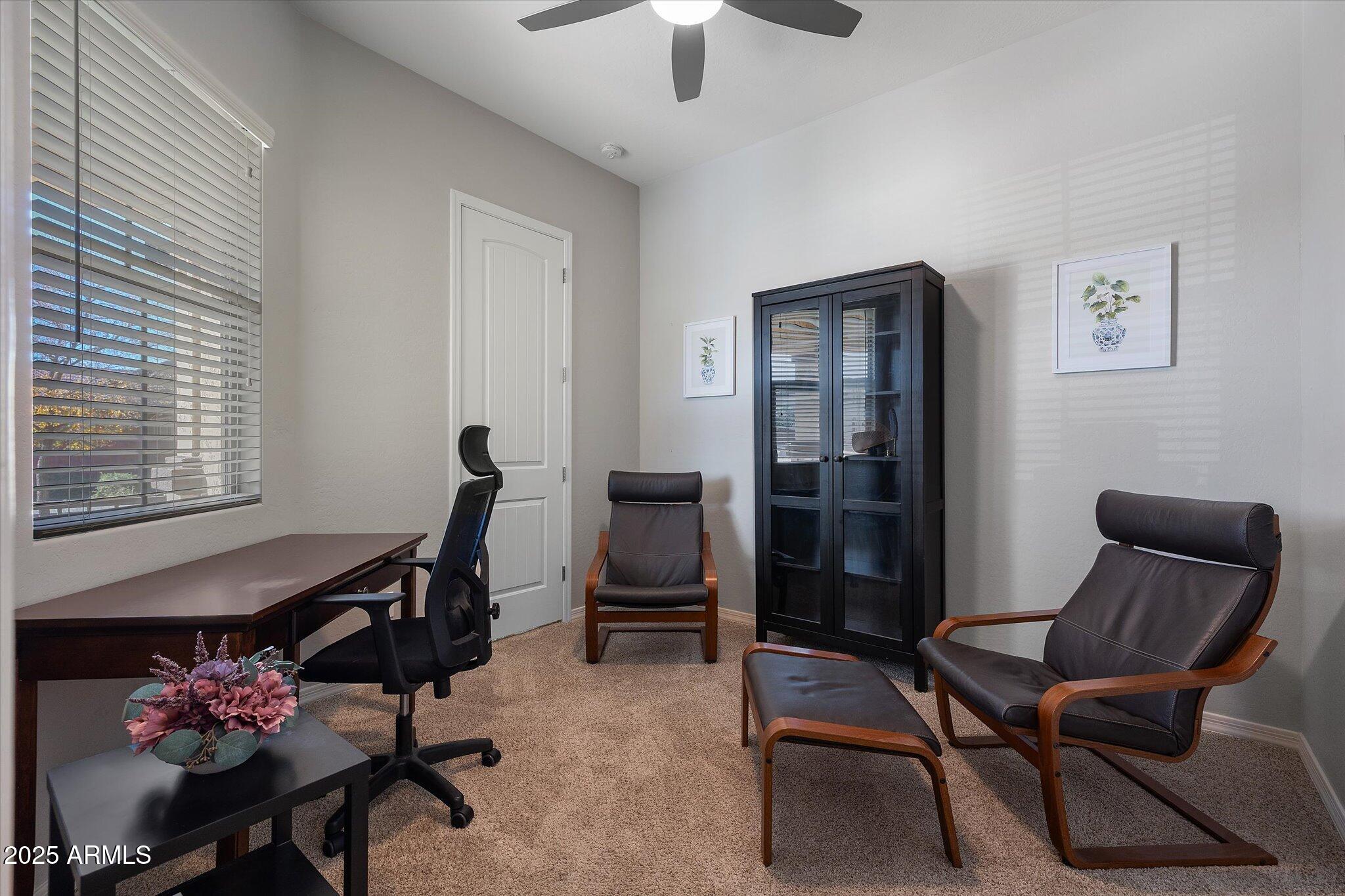 2527 South Quaintance Street Gilbert, AZ 85295 - Photo 15 of 36 a view of a workspace with furniture and a window