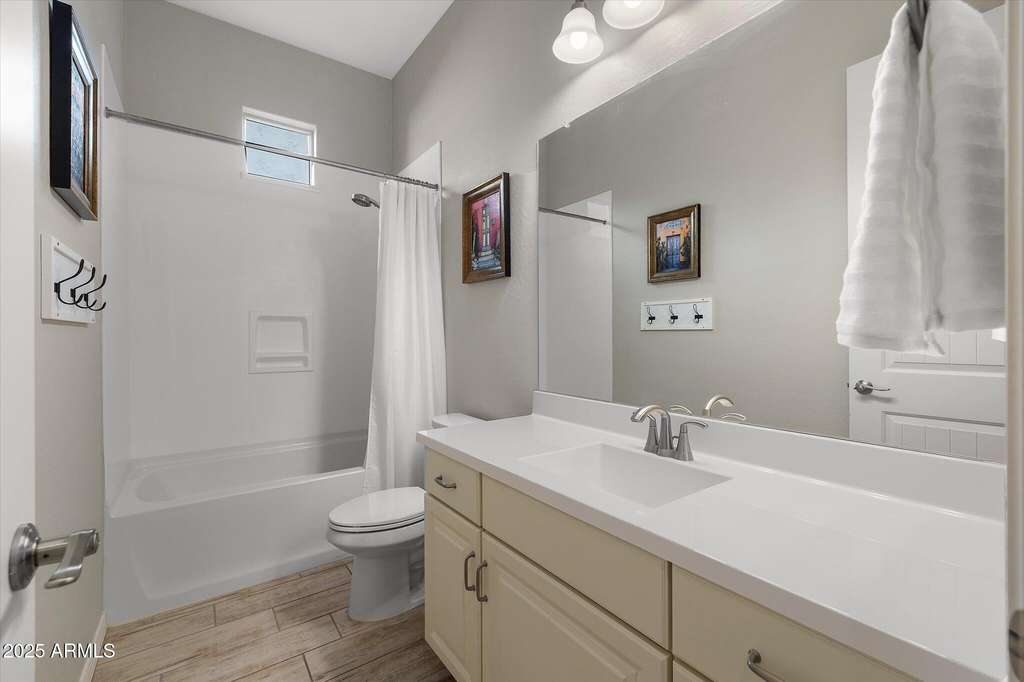 2527 South Quaintance Street Gilbert, AZ 85295 - Photo 16 of 36 a bathroom with a sink a toilet and shower