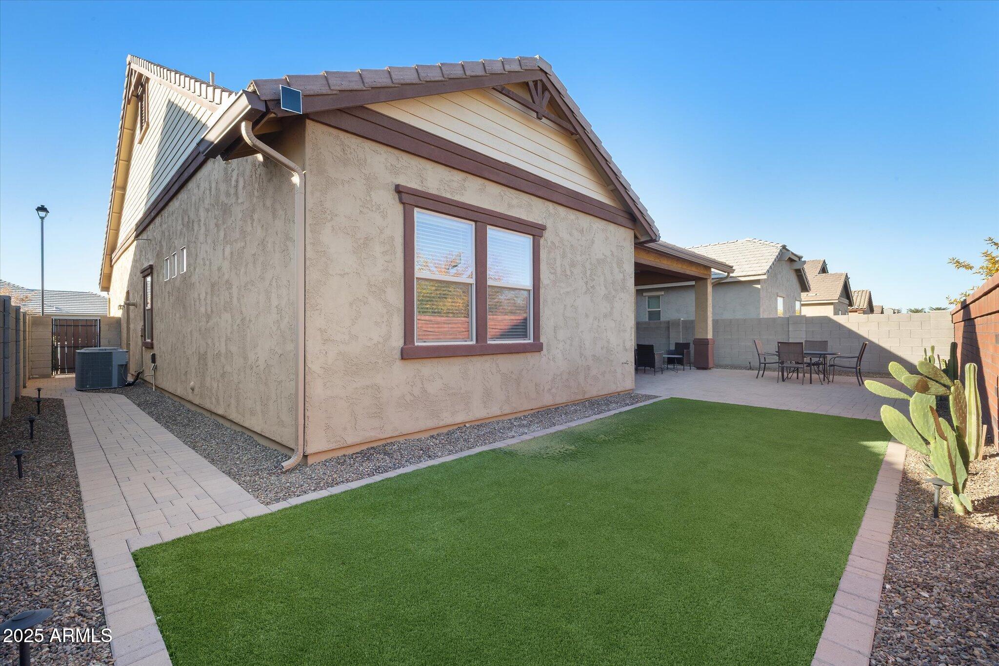 2527 South Quaintance Street Gilbert, AZ 85295 - Photo 21 of 36 a view of a house with a yard