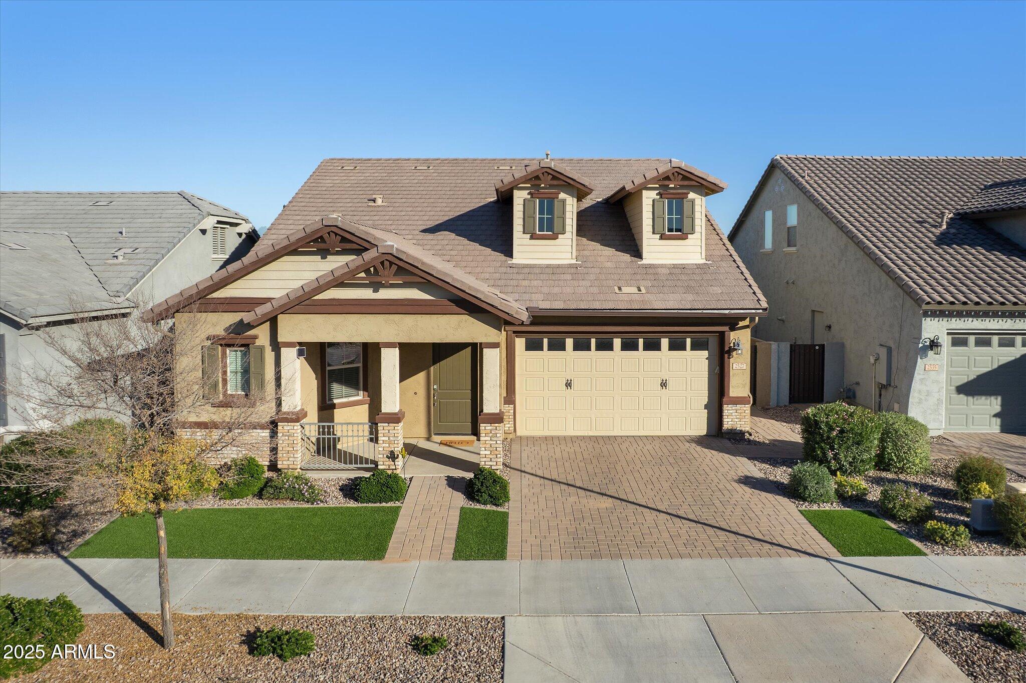 2527 South Quaintance Street Gilbert, AZ 85295 - Photo 2 of 36 a front view of a house with a yard