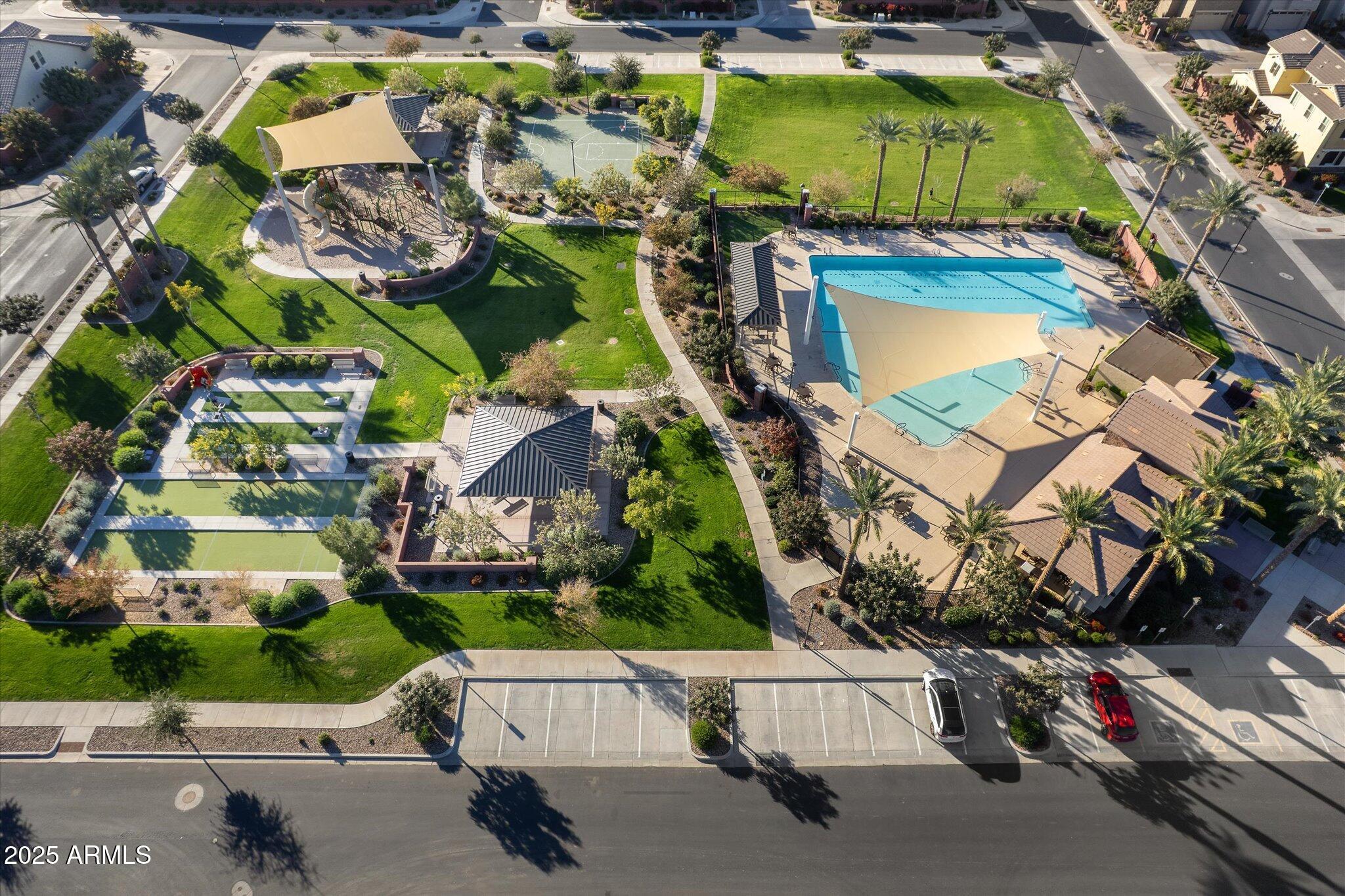 2527 South Quaintance Street Gilbert, AZ 85295 - Photo 33 of 36 an aerial view of a house with a garden and parking space