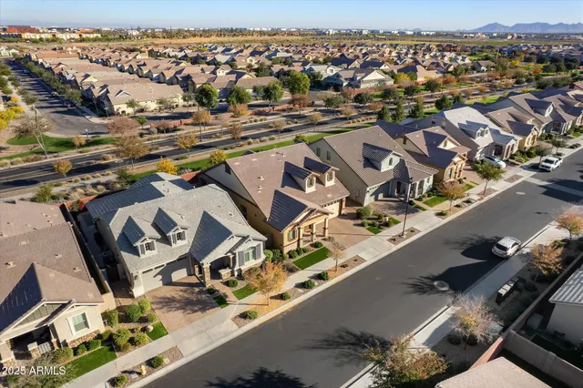 an aerial view of a house with a yard