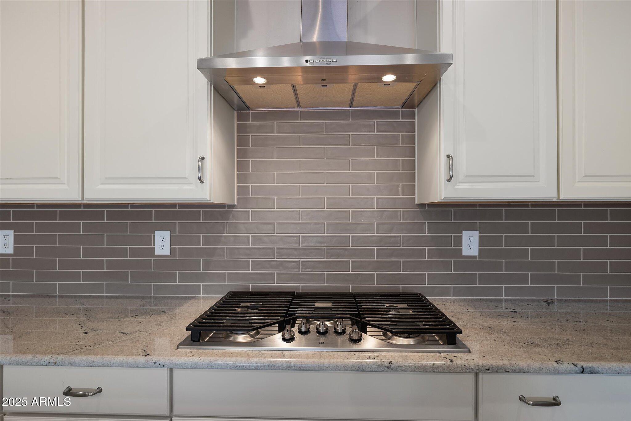2527 South Quaintance Street Gilbert, AZ 85295 - Photo 6 of 36 a kitchen with granite countertop white cabinets