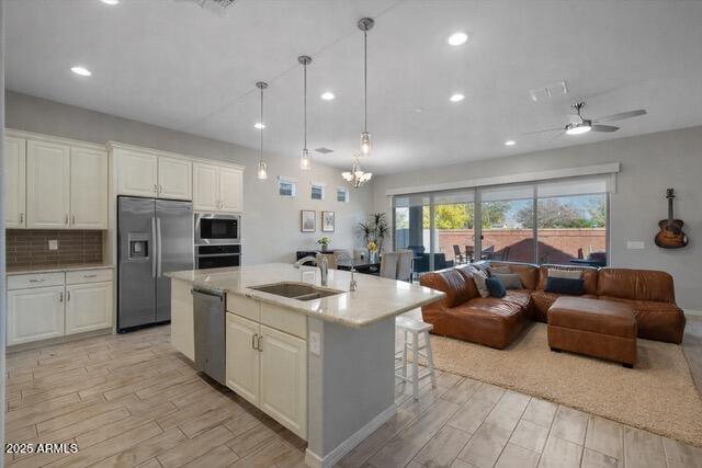 2527 South Quaintance Street Gilbert, AZ 85295 - Photo 7 of 36 a large white kitchen with a large window