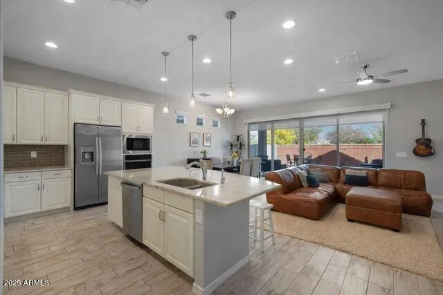 a kitchen with granite countertop white cabinets