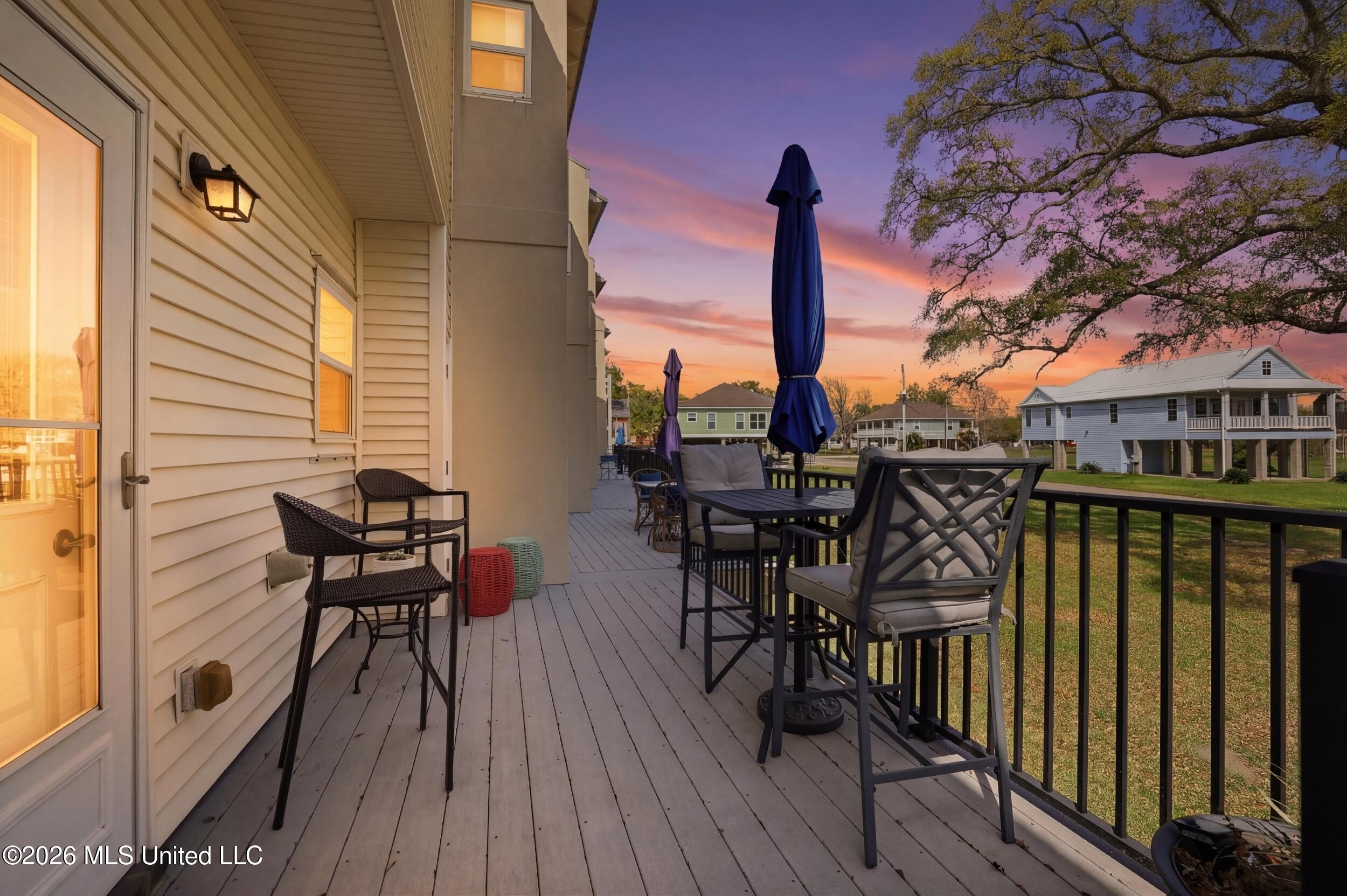 548 West Beach Boulevard, Unit 110 Pass Christian, MS 39571 - Photo 2 of 42 2_028_r6__4989_twilight_dcaa77a6-73b0-49