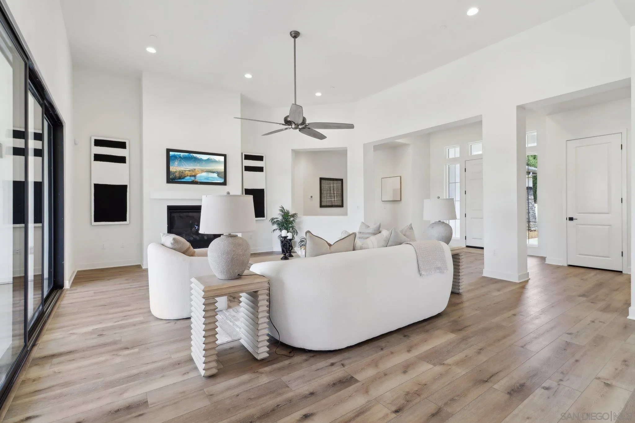 2745 Alexander Drive Escondido, CA 92029 - Photo 12 of 39 a living room with couches a flat screen tv and kitchen view