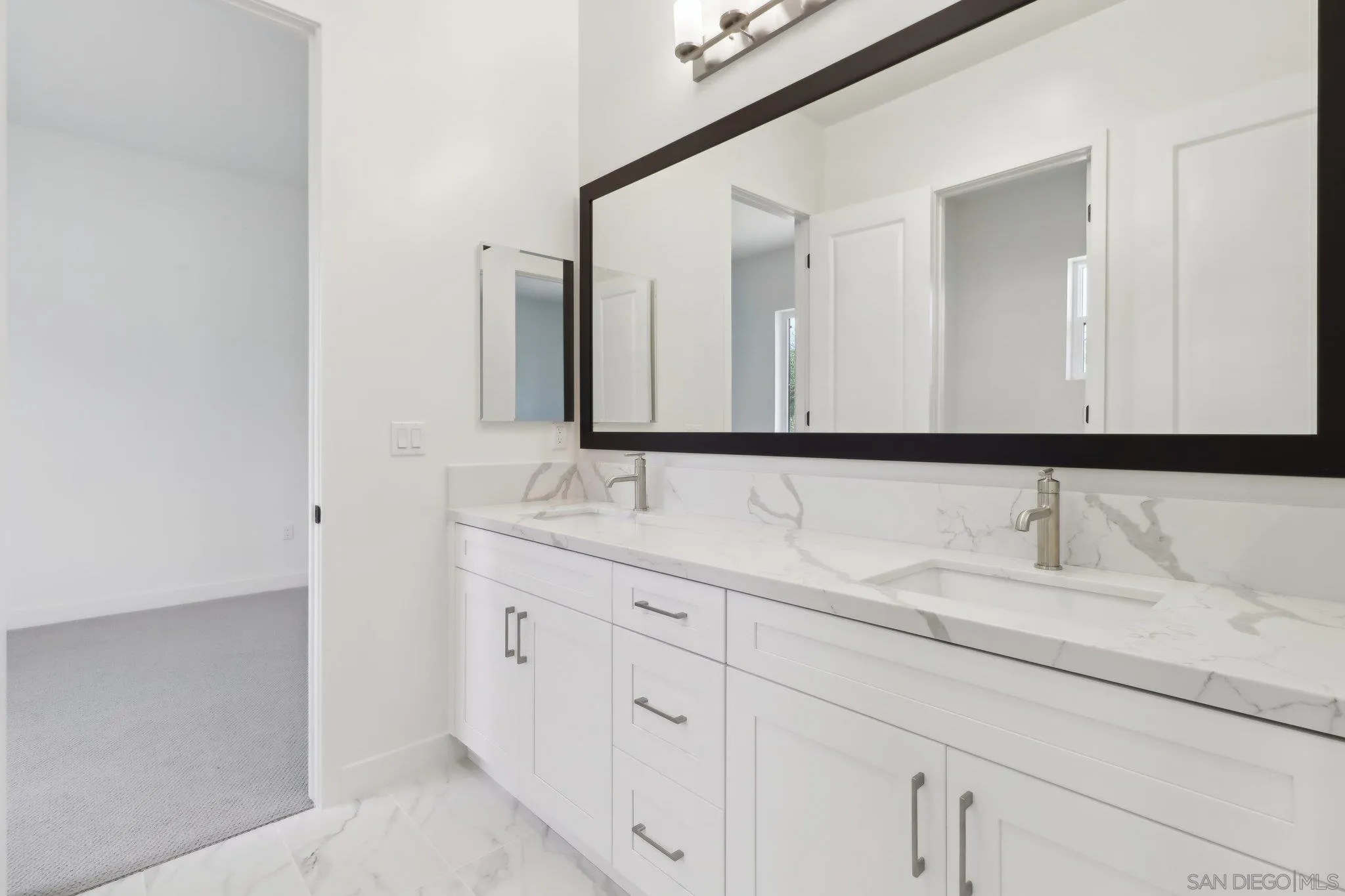 2745 Alexander Drive Escondido, CA 92029 - Photo 14 of 39 a bathroom with a double vanity sink and a mirror