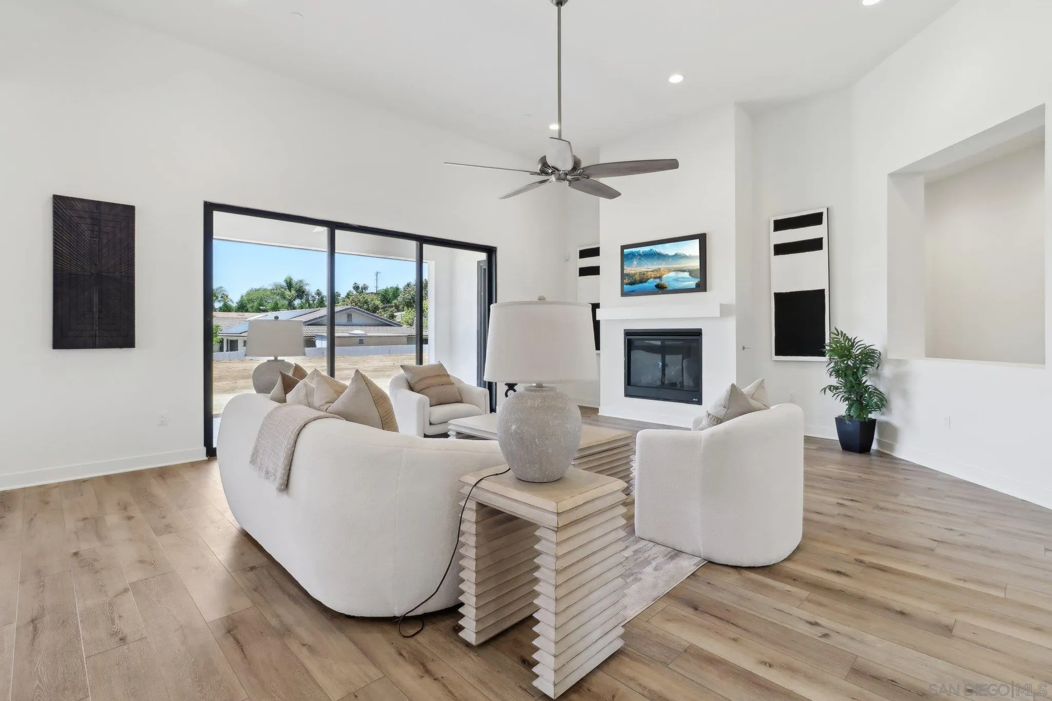 2745 Alexander Drive Escondido, CA 92029 - Photo 16 of 39 a living room with furniture fireplace and flat screen tv