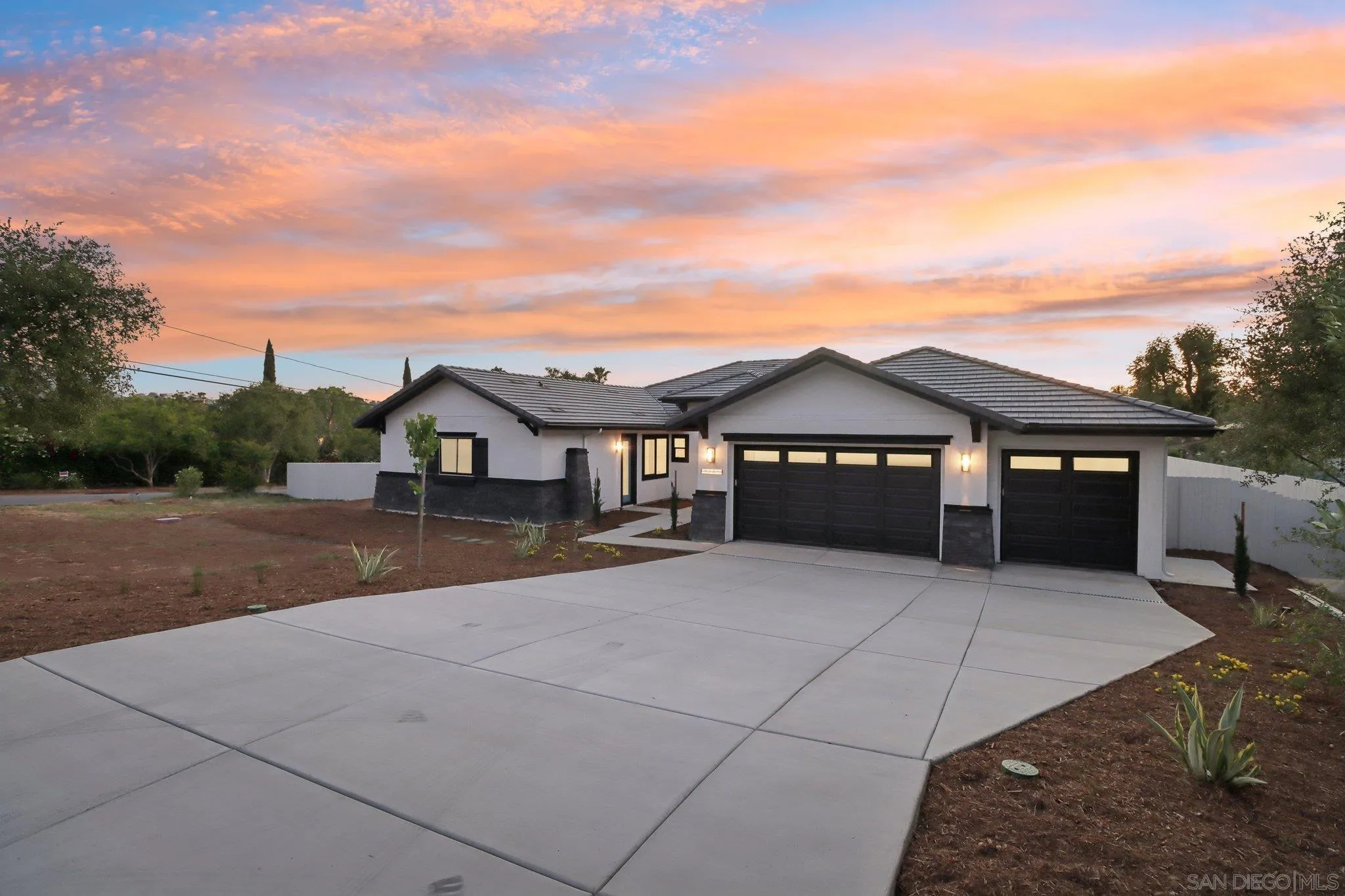 2745 Alexander Drive Escondido, CA 92029 - Photo 36 of 39 a front view of a house with a yard and garage