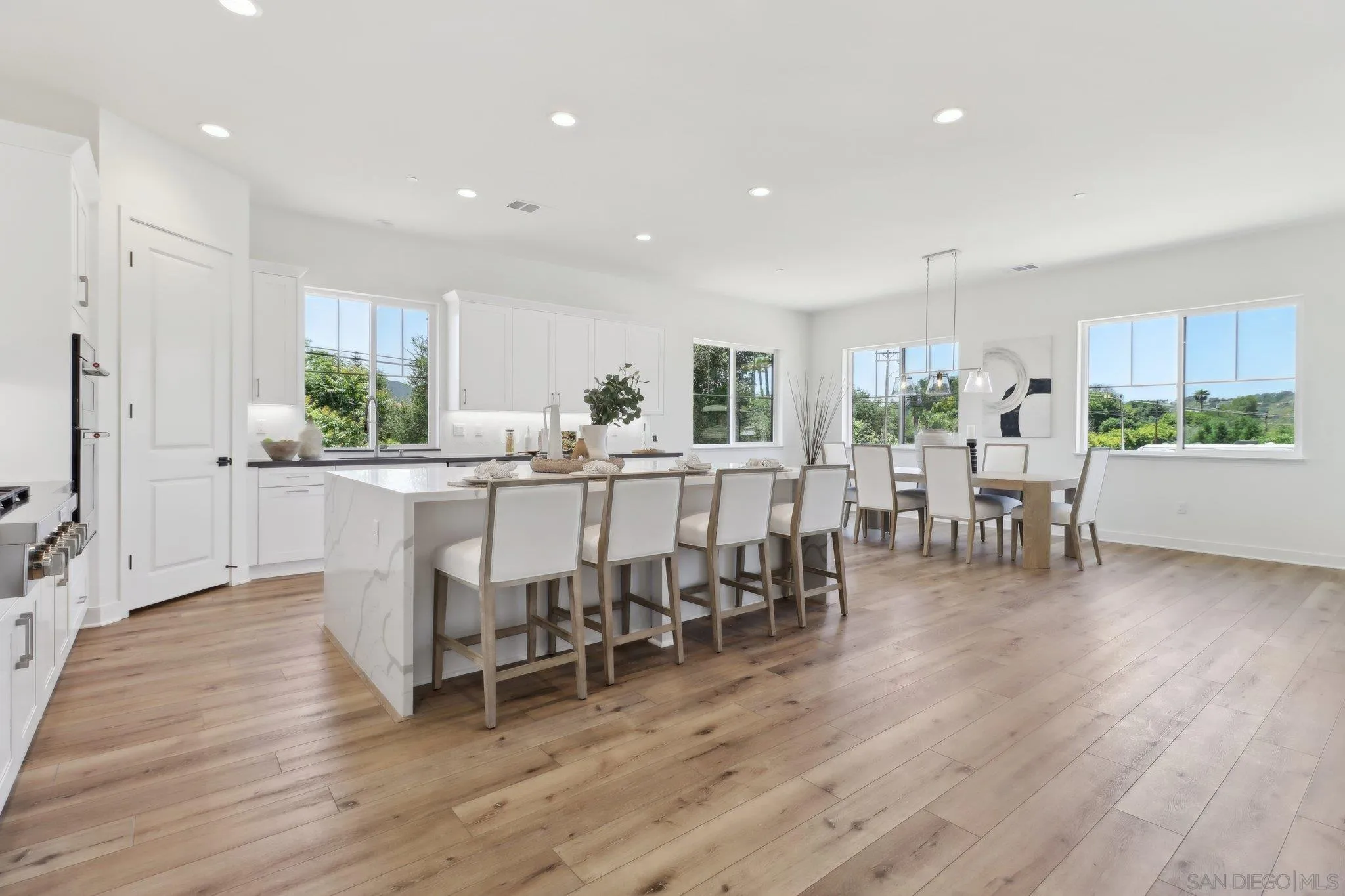 2745 Alexander Drive Escondido, CA 92029 - Photo 7 of 39 a dining room with furniture wooden floor and a rug