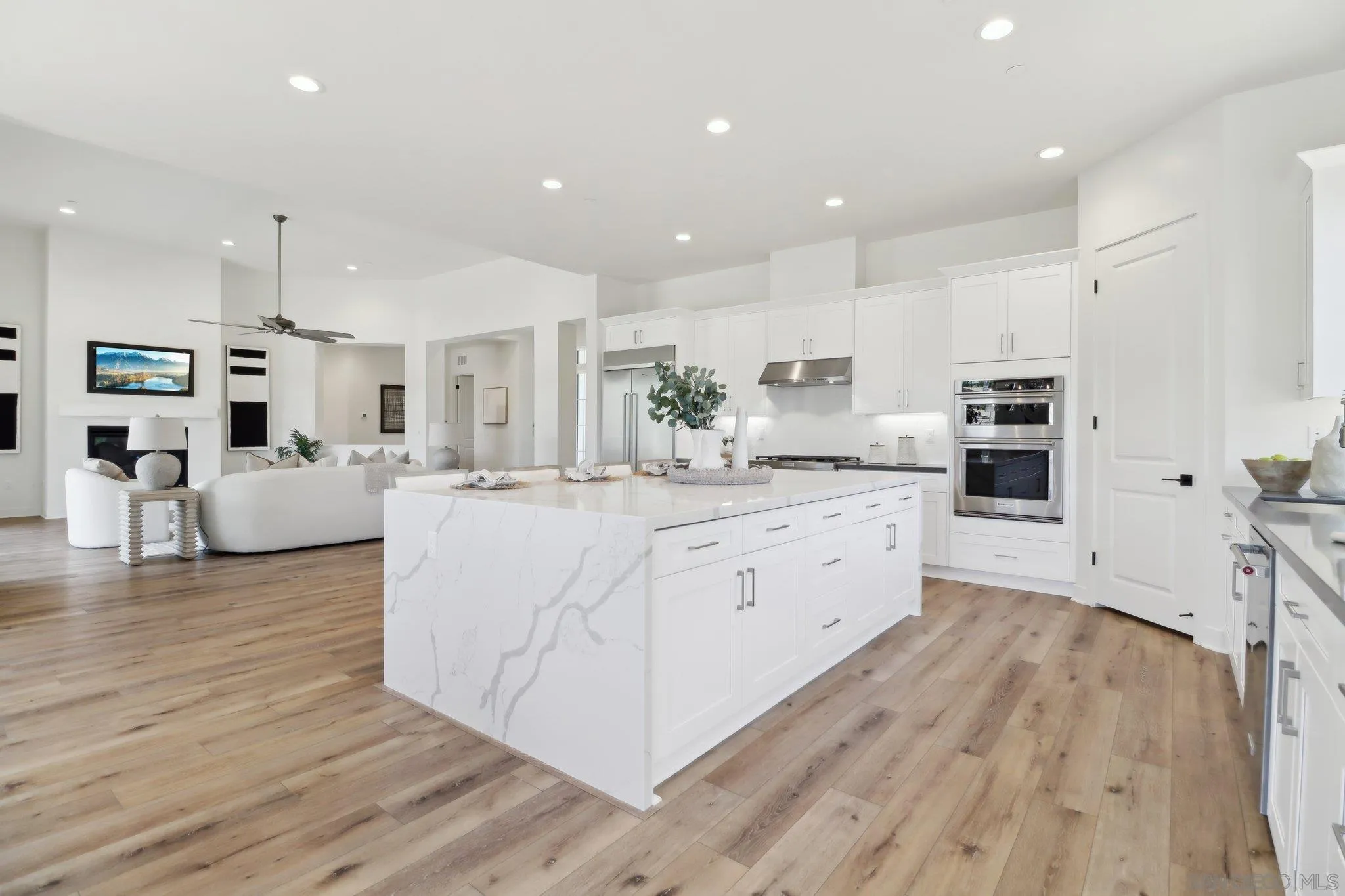 2745 Alexander Drive Escondido, CA 92029 - Photo 9 of 39 a large kitchen with stainless steel appliances granite countertop a large center island attached withe living room