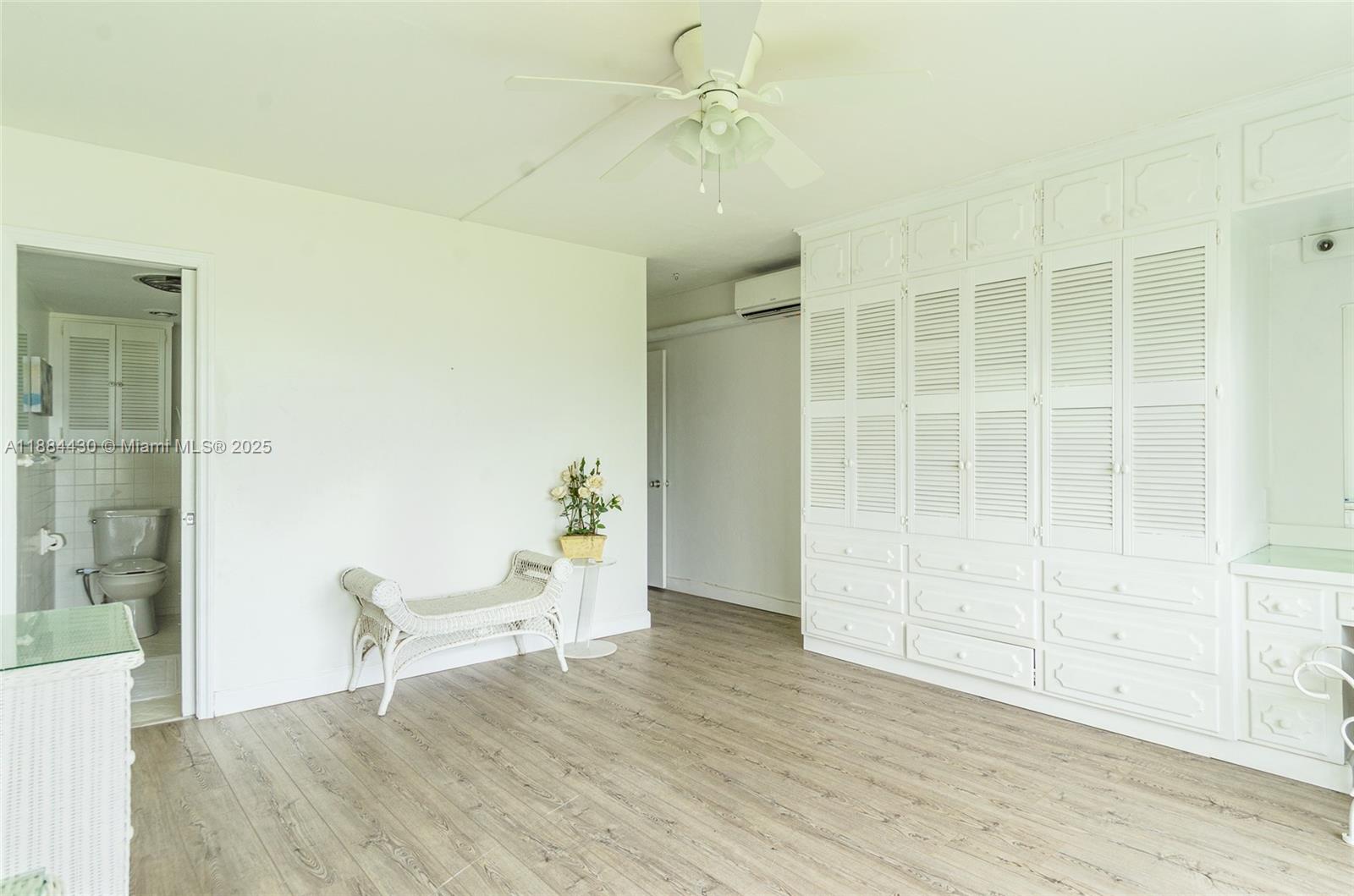 1470 South Ocean Boulevard, Unit 702 Pompano Beach, FL 33062 - Photo 12 of 15 wooden floor in an empty room with a window