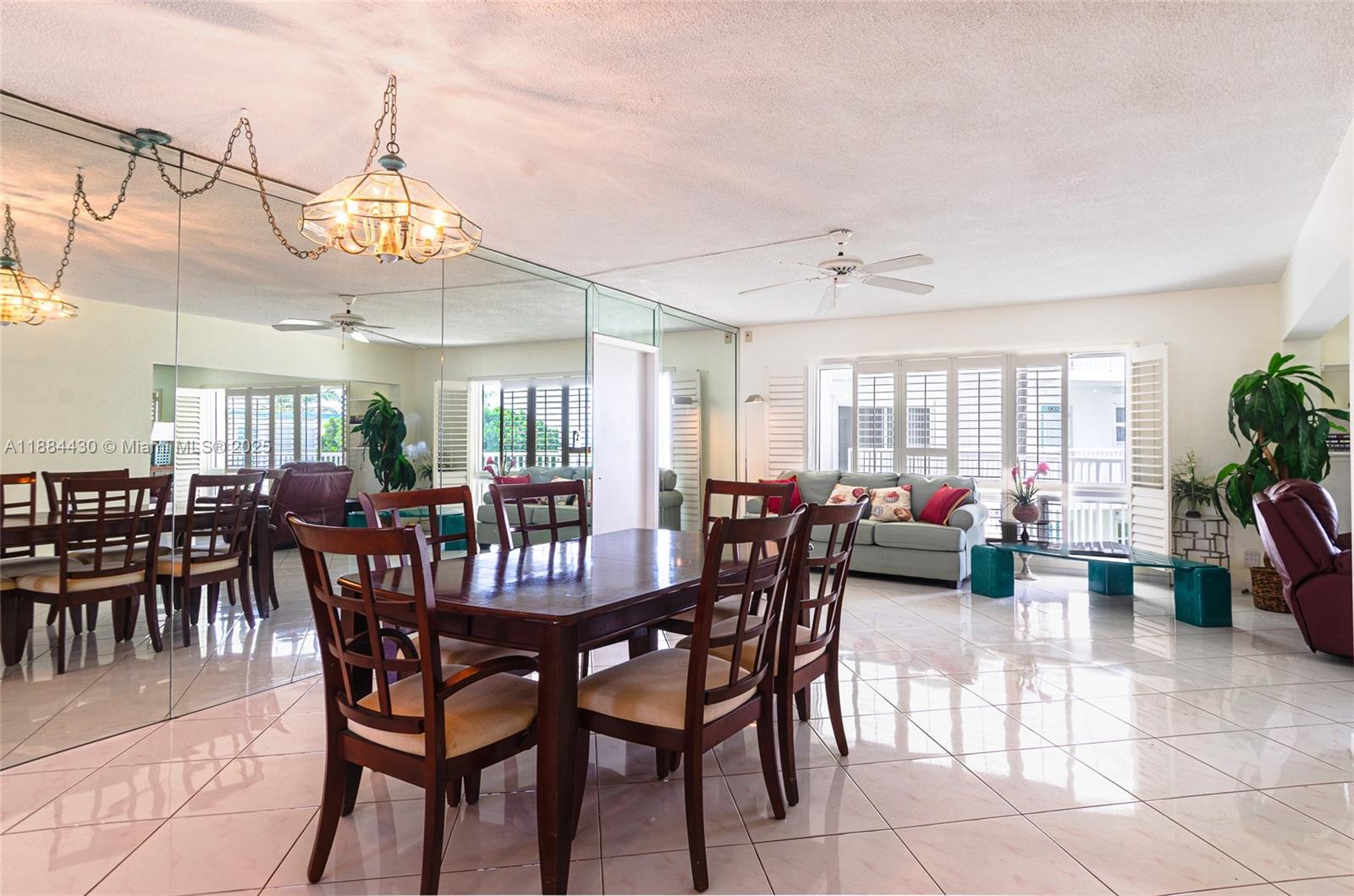 1470 South Ocean Boulevard, Unit 702 Pompano Beach, FL 33062 - Photo 3 of 15 a view of a dining room with furniture and a chandelier