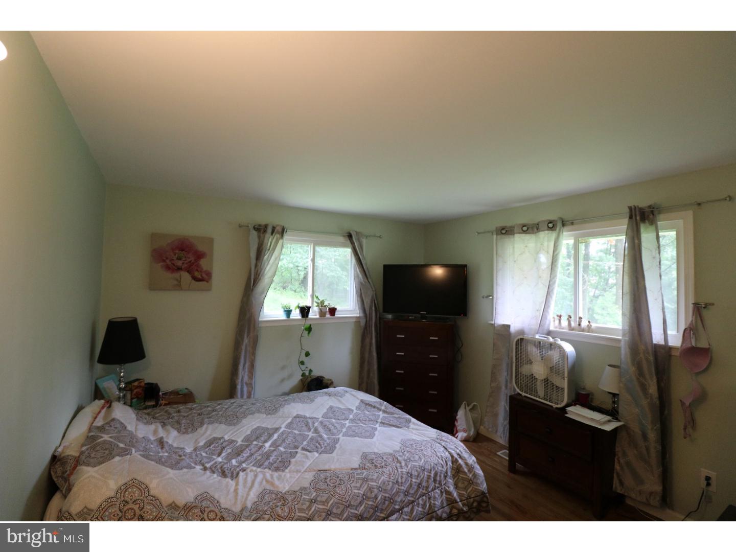 2571 Welsh Road Mohnton, PA 19540 - Photo 14 of 23 a bedroom with a bed and a flat tv screen on dresser