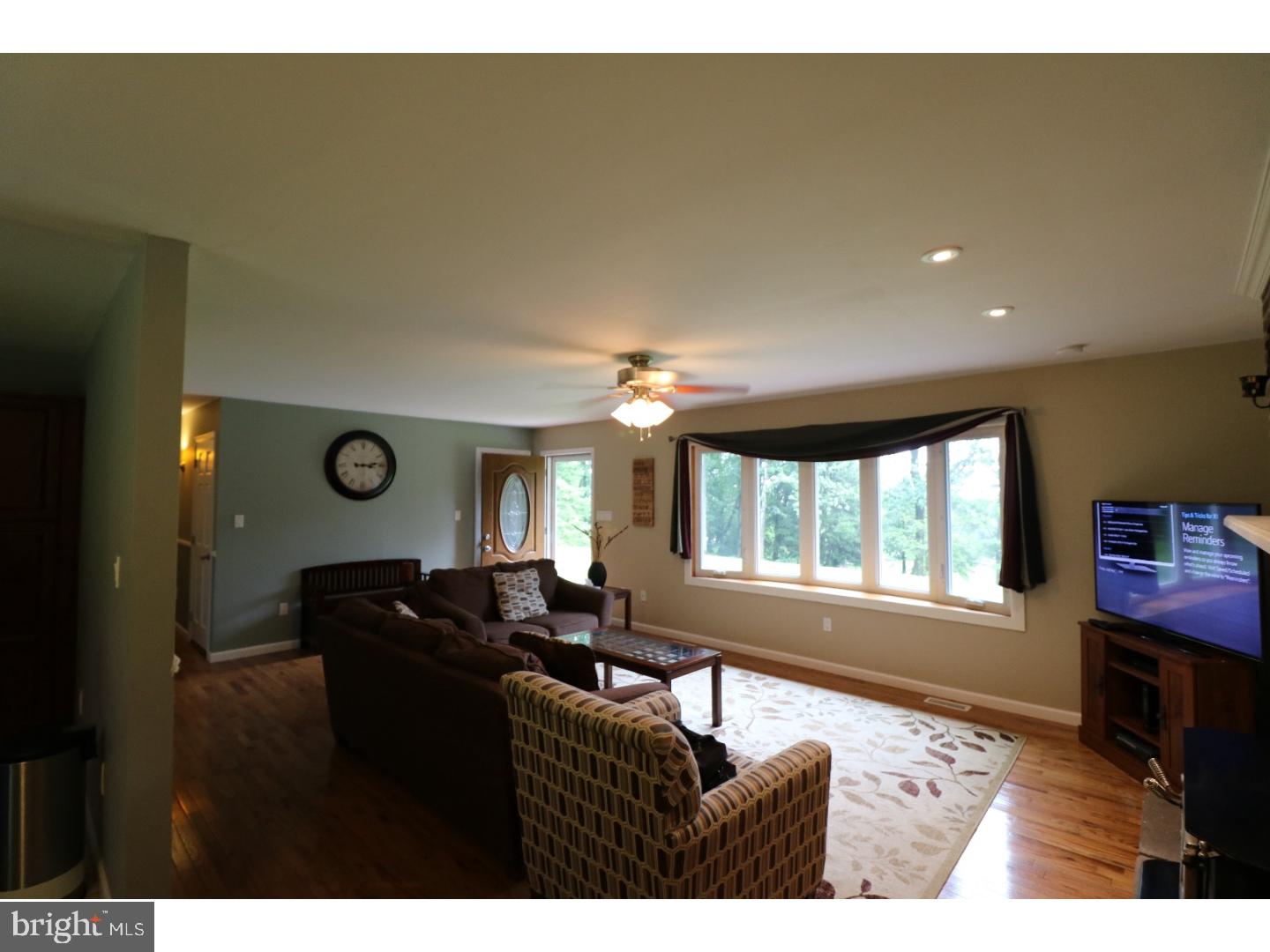 2571 Welsh Road Mohnton, PA 19540 - Photo 2 of 23 a living room with furniture windows and a flat screen tv