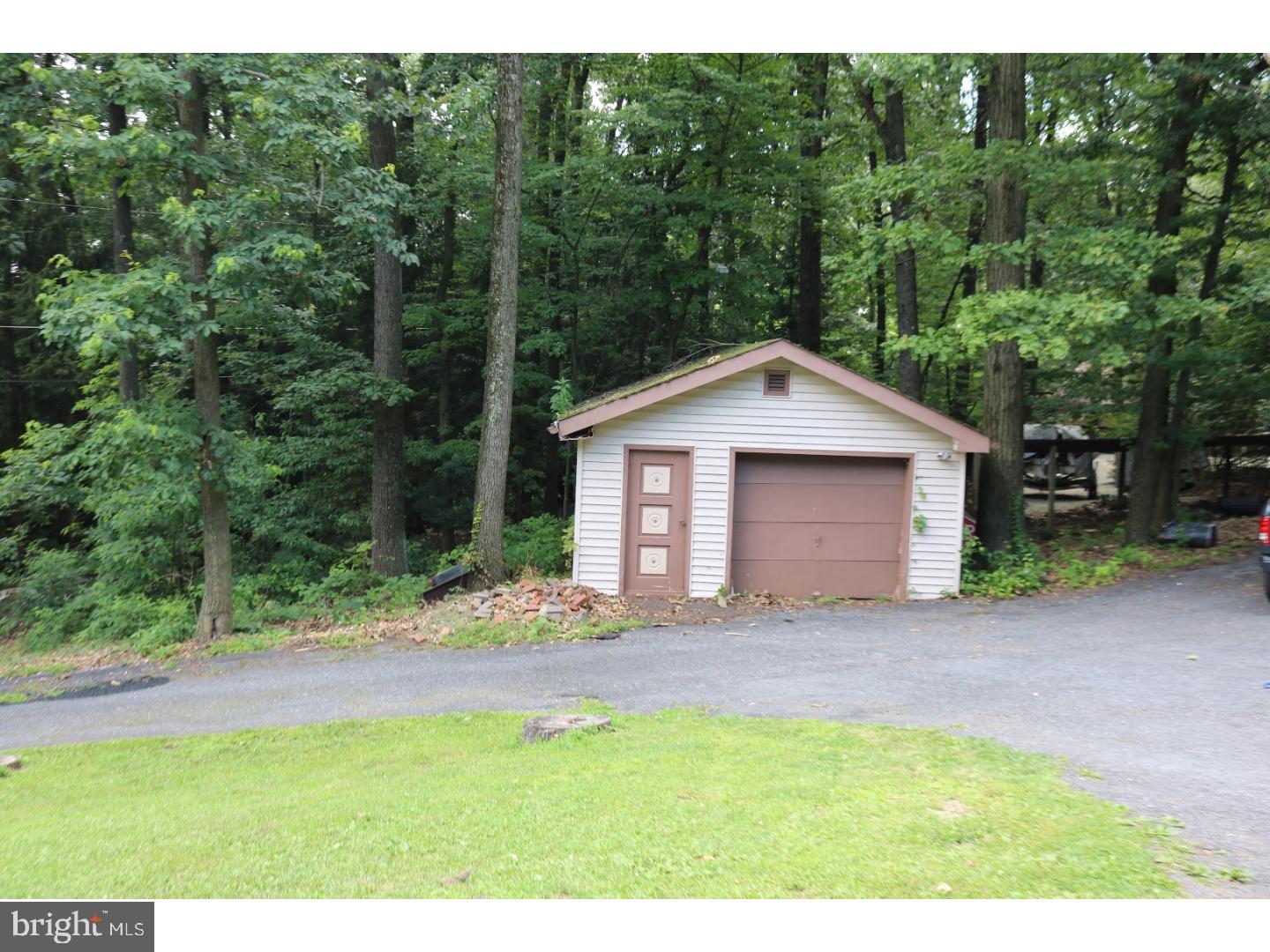 2571 Welsh Road Mohnton, PA 19540 - Photo 23 of 23 a front view of a house with a yard and garage