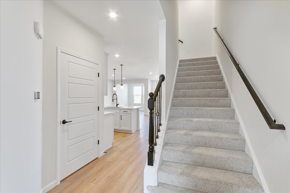 692 Switchgrass Way, Unit 57004 Bolingbrook, IL 60490 - Photo 11 of 25 a view of entryway and hall with wooden floor