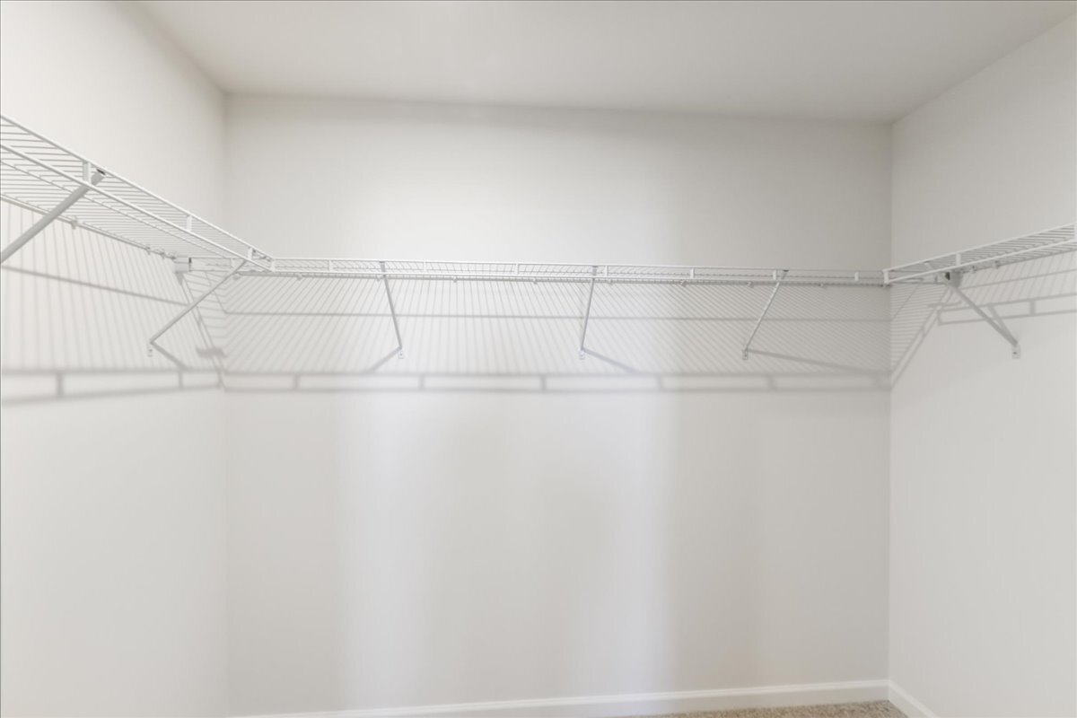 692 Switchgrass Way, Unit 57004 Bolingbrook, IL 60490 - Photo 20 of 25 a bathroom with a shower